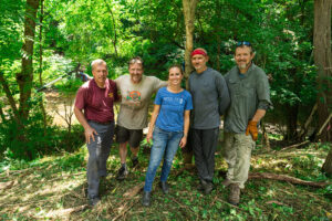 Volunteers clean up trail area near downtown dog park